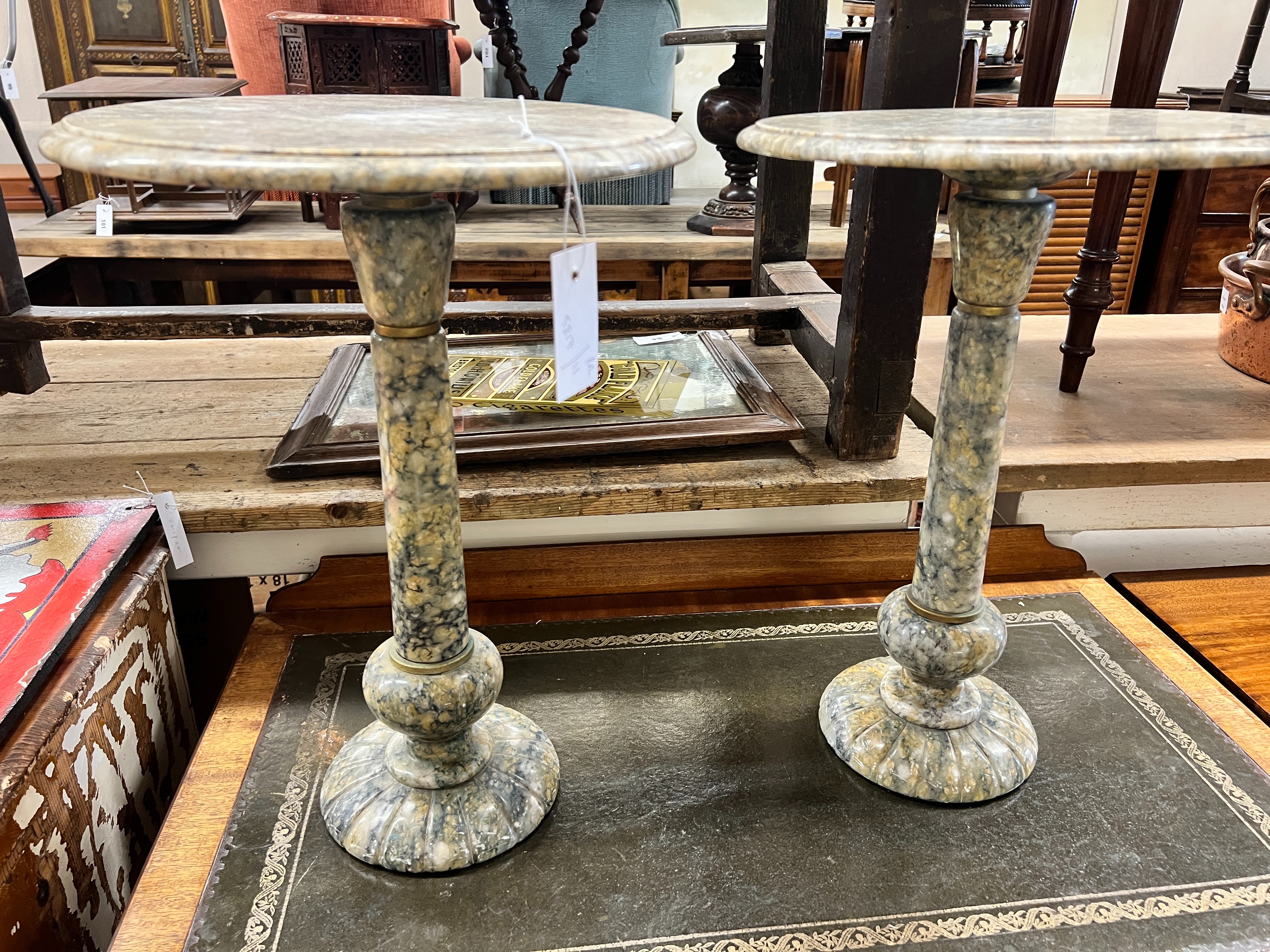 A pair of circular reconstituted marble wine tables, diameter 35cm, height 49cm